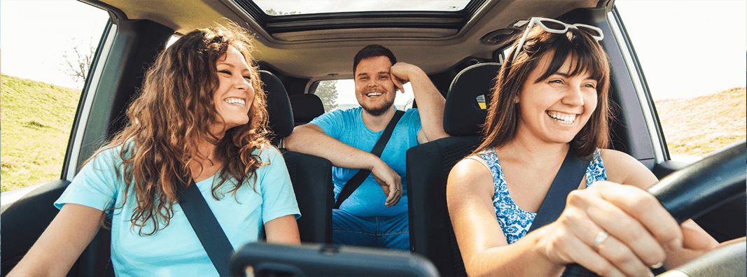 Three friends in a car