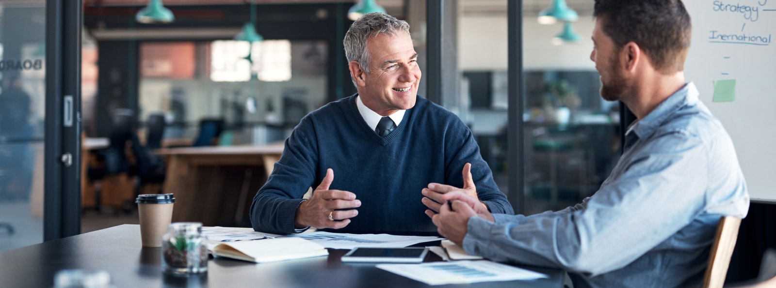 two men in a meeting