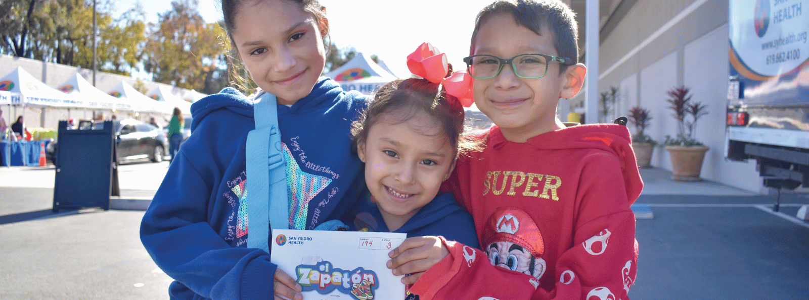 Three young kids smiling
