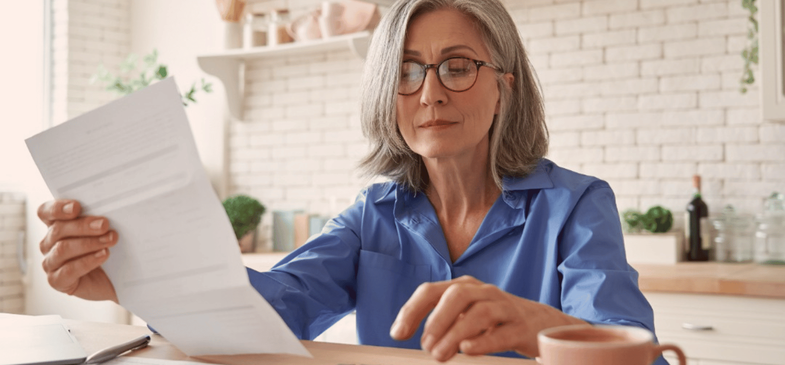 Woman looking over paperwork.