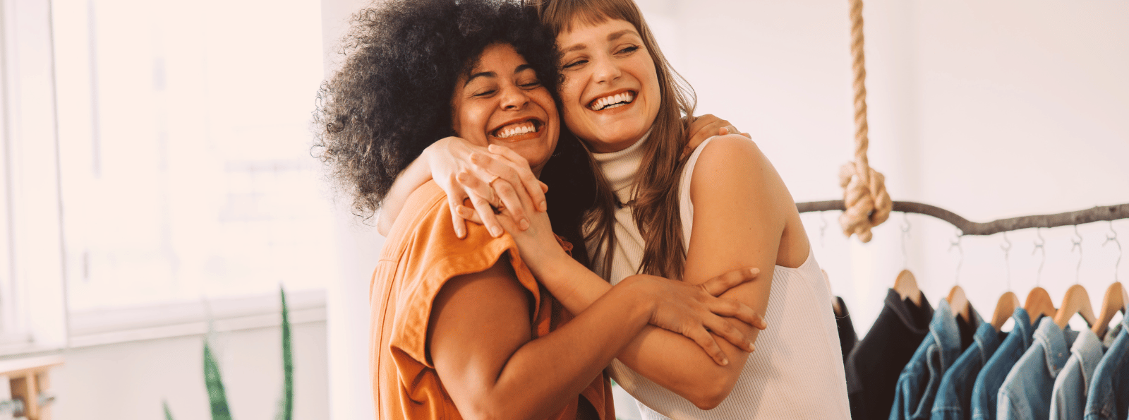 Two business women hugging