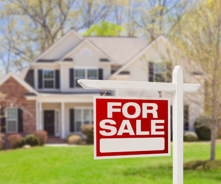 "For Sale" sign outside of a home.